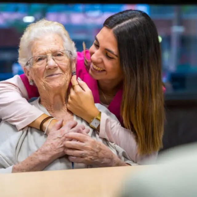 caring lifestyle coordinator with resident